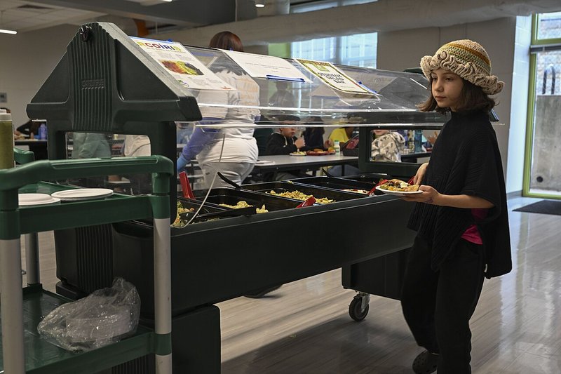 Students use a salad bar at DC Bilingual Public Charter School