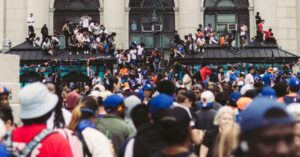 Large crowd gathered for an outdoor city street festival