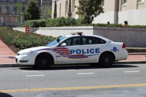 A marked Metropolitan Police Department Chevrolet Impala patrol vehicle parked on a city street in Washington, D.C.