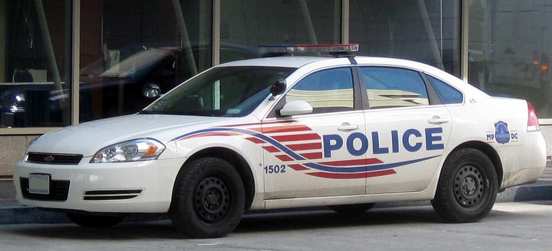 A Washington, D.C. Metropolitan Police Department Chevrolet Impala cruiser parked on a city street.