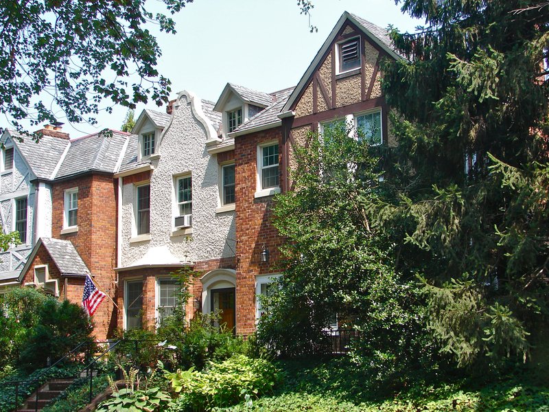 Historic residential buildings along a tree-lined street in Woodley Park in Northwest Washington, D.C.